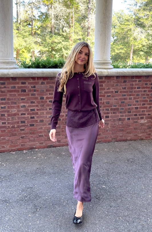 In motion view of plum slip skirt with lace overlay