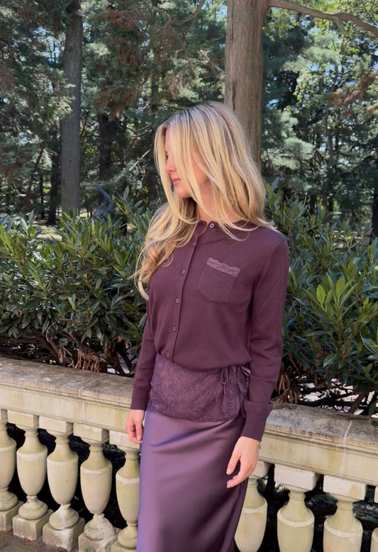 Front view of plum cardigan with lace trim pocket detail on chest