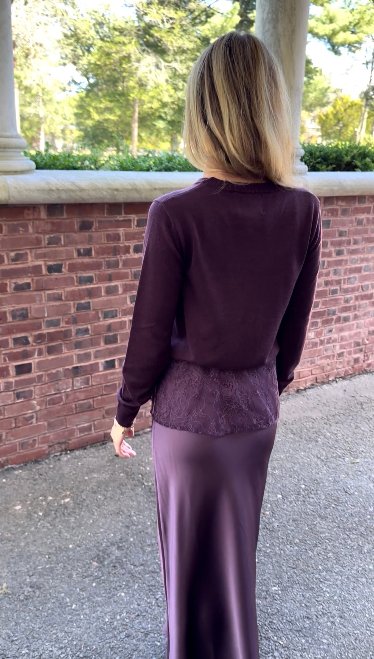 Back view of plum slip skirt with lace overlay
