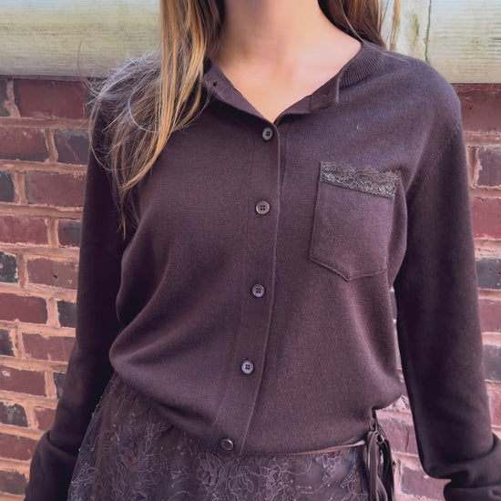Video of chocolate brown cardigan with lace trim pocket detail on chest