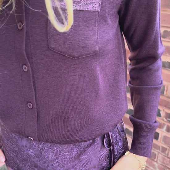 Video of plum cardigan with lace trim pocket detail on chest