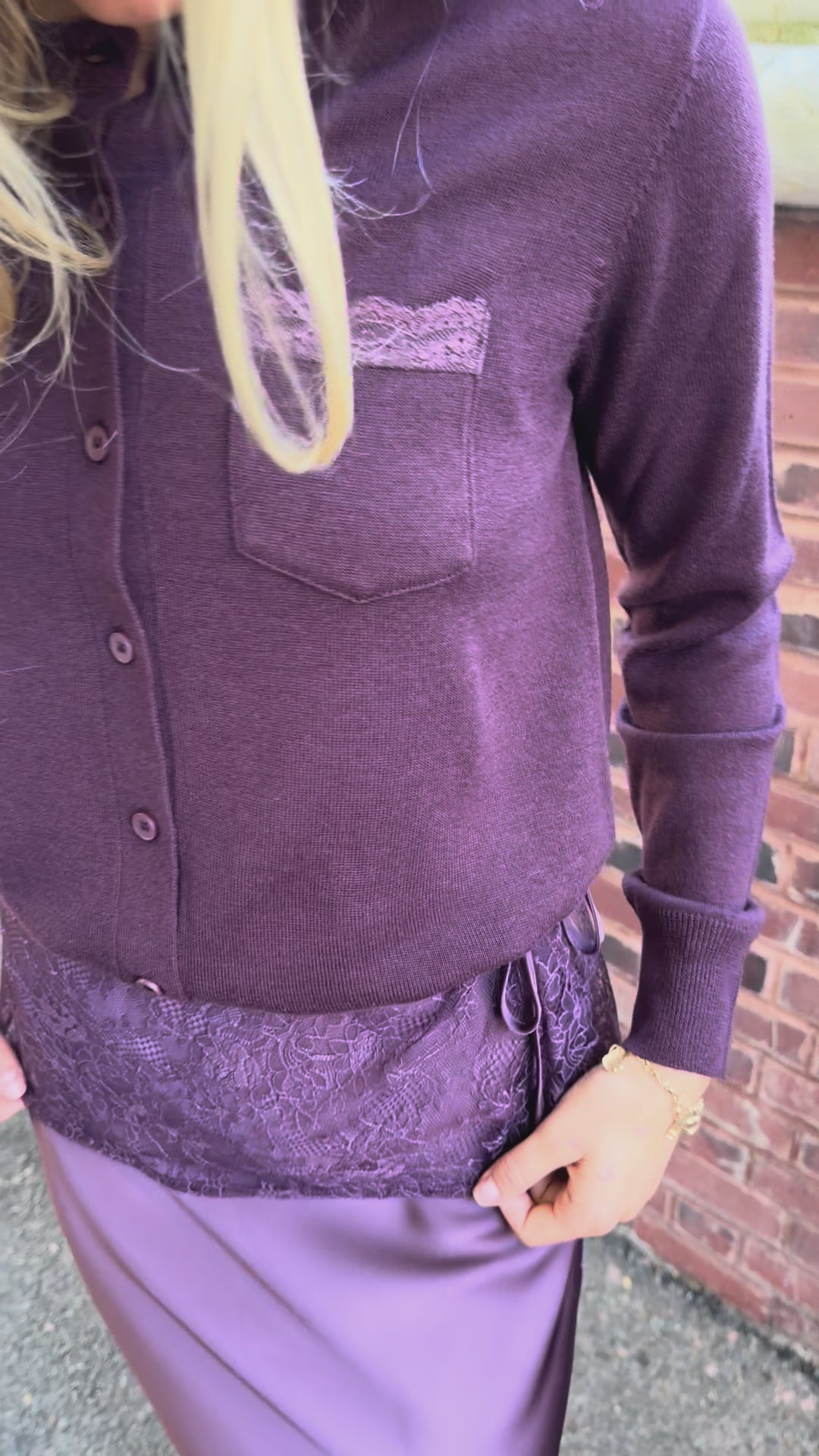 Video of plum cardigan with lace trim pocket detail on chest